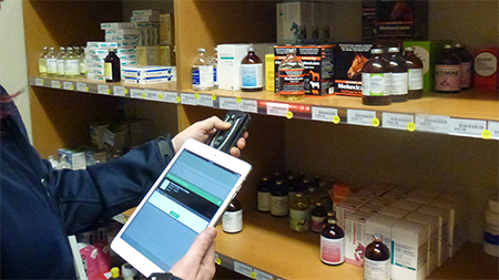 Fig. 3: Jo scanning products in the pharmacy into the StockLink© App using a Bluetooth scanner and an iPad